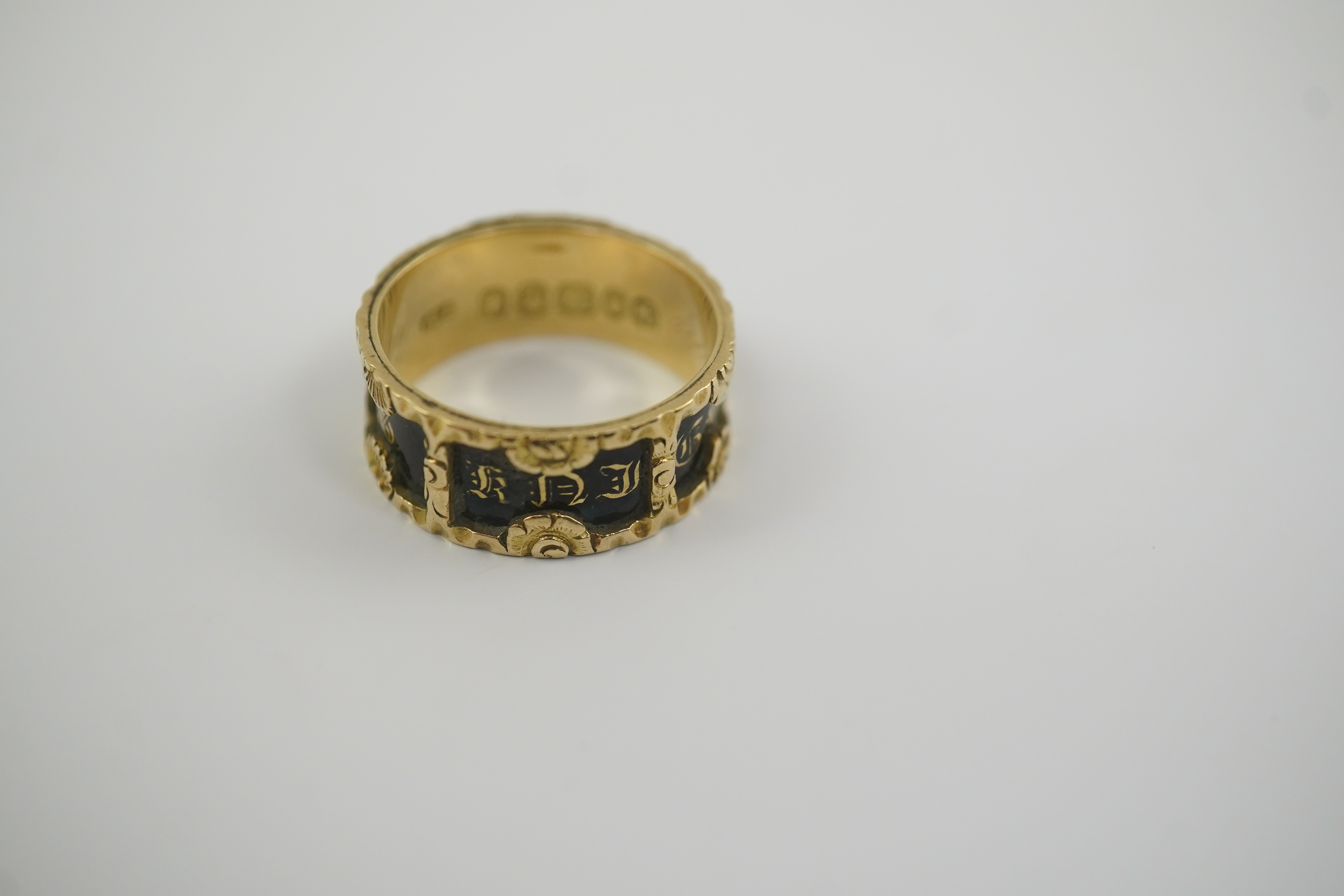 An early Victorian 18ct gold and black enamel initial mourning band